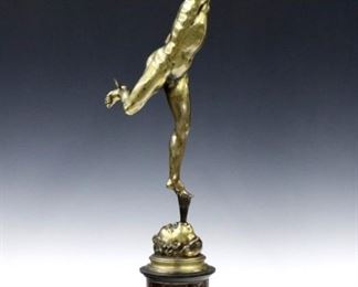 A turn of the century Bronze figure of Mercury after Giambologna, Flemish/Italian, 1529-1608.  Depicted with caduceus on a Rouge Marble and Ebonized wood plinth.  Some wear to patina, repaired finger, Marble with minor damage.  27" high.  ESTIMATE $300-400
