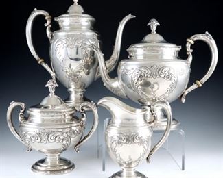 A mid 20th century Towle "Old Master" pattern Sterling Silver tea set.  Includes a coffee pot, teapot, creamer, and covered sugar with repousse scroll heart decoration.  Each impressed "Towle" and "Sterling".  74.30 troy ozs total.  Minor surface wear.  Up to 11" high.  ESTIMATE $1,500-2,500
