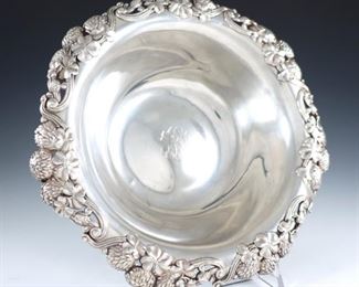 A late 19th century Tiffany Sterling Silver fruit bowl with reticulated clover bloom decoration.  Impressed "Tiffany & Co." and "Sterling Silver 925".  17.63 troy ozs total.  Monogrammed, minor surface wear, some small dents to base.  10" diameter.  ESTIMATE $400-600
