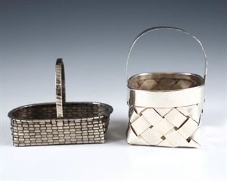 Two Sterling Silver miniature woven baskets.  Includes a Cartier basket with hammered handle and a Spanish basket with wrapped handle.  Marked "Cartier, Hand Made, Sterling", Spanish with hallmarks and " Joyero Ataulfo, La Coruna" jewelers sticker.  2.24 troy ozs total.  Minor surface wear.  Up to 3" high.  ESTIMATE $200-400
