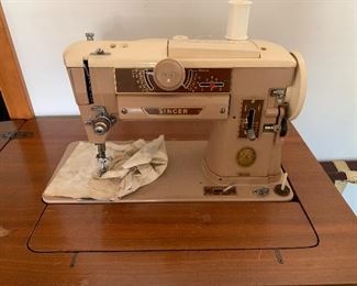 singer sewing machine in cabinet