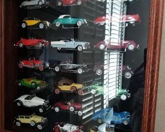Shadow box with 21 cars in each 3 available 