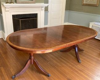 Mahogany double-pedestal, banded inlay dining table with two ,21.5" leaves  (total table length with both leaves 93.5").  $1,000