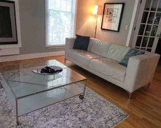 Modern Glass coffee table on wheels, many room size rugs