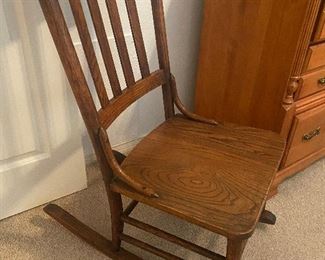 Early 1900s Mission style oak rocking chair........To register and to place bids simply go to www.capitolsalesservices.hibid.com