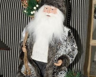 Fur wrapped Santa with gifts.