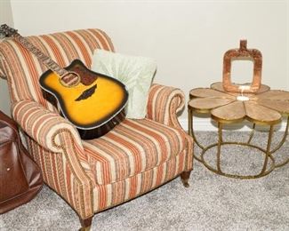 Striped easy chair with tulip wood coffee table and Keith Urban guitar