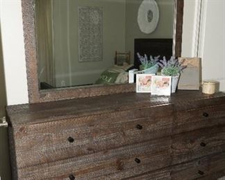 Distressed hardwood dresser with mirror and a bed frame to match