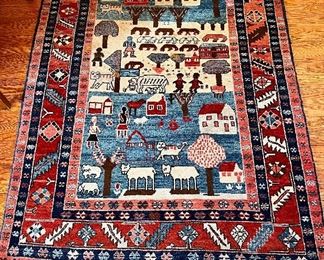 Item 4:  Wool Rug (red with animals & figures) There are some imperfections in the rug - see more photos for detail- 5' x 6'10":  $385