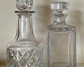 Item 75:  Orrefors Decanter (left) - 10":  $58                                                             Item 76:  Atlantis Decanter (right):  9.25":  $24
