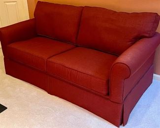 Item 172:  Maroon Pull Out Loveseat - 70"l x 21"w x 28.5"h: $425