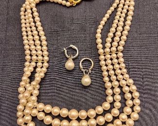 Multi-strand pearls with pearl earrings
