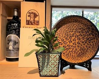 Painted wood leopard bowl; empty magnum of Silver Oak wine with box
