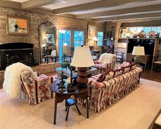 Farmhouse chic!  Vintage sofa and pair of armchairs.  Noe Canjura oil painting, antique English fender, antique side tables.