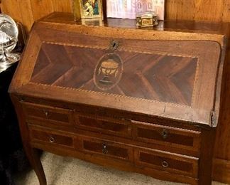 Mid to late 1800s MARQUETRY desk. Secret drawer. Exhibit signs of use and age. Multiple ink stains inside from over a century and a half of use.