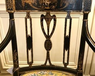 Napoleon III black lacquer chair. Frame is decorated and guilt urn and drape motif. Elegant shaped open arms with gilded supports.