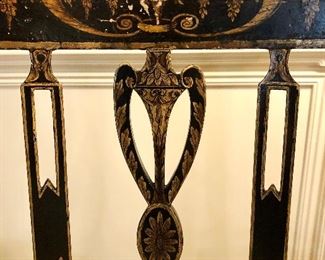 Napoleon III black lacquer chair. Frame is decorated and guilt urn and drape motif. Elegant shaped open arms with gilded supports.