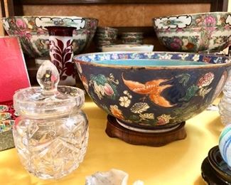 Chinese Qianlong Enameled bowl. Floral, fruit, and butterflies raised to the touch. Artist signed in red on the bottom.