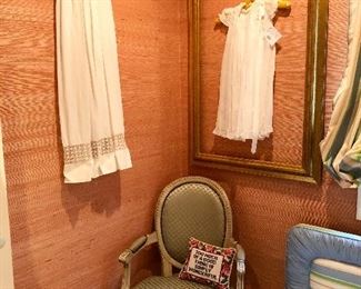 Antique hand sewn christening gowns. Louis XVI style chair. Silk upholstery has shattered in the front.