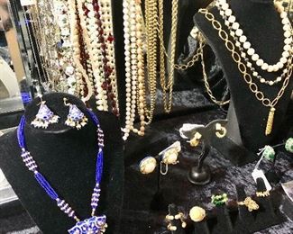 A dazzling assortment of costume jewelry. Clip and pierced earrings.