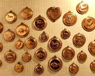 A marvelous selection of copper and brass molds; fish, ducks, roosters, chicks, hens, in every size! Bright and shiny.