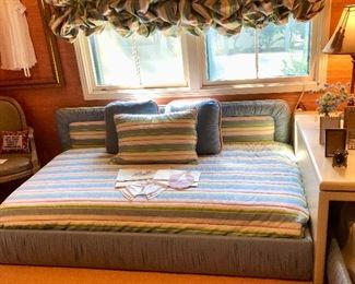 Complete daybed set. BLUE. Includes custom upholstered bolster back and pleated covered frame, mattress and box springs, coverlet, and three matching upholstered pillows.