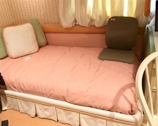 Complete daybed set. PEACH  Includes custom upholstered bolster back and pleated covered frame, mattress and box springs, coverlet, and three matching upholstered pillows.