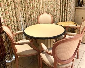 Set of 4 Louis XVI style bergère chairs. Wheat patterned upholstery with salmon Checker Board backs. Frames are painted in a soft salmon color with gold rub.