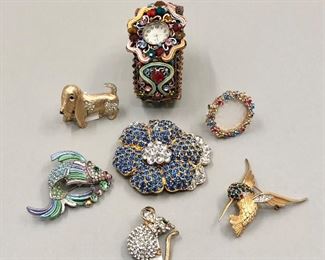 Israeli jewelry designer, AYALA BARR, rhinestone watch.  Replica of
Jacqueline Kennedy’s Empress Blue flower brooch. 