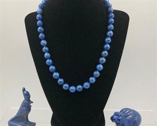 Lapis Lazuli beads and carved figures. 