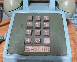Vintage push button phone in blue.