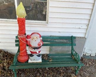 Wooden bench and blow mold figures.