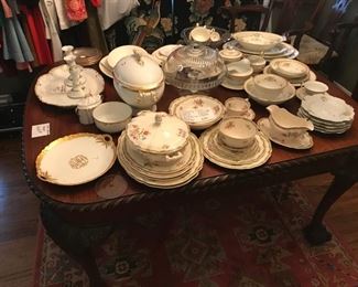 The table is from the 20's with an extension that lifts up   when needed, dishes are all limoges, France and many hard to find pieces. 