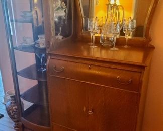 Meticulously well cared for China Curio cabinet with mirrored sideboard storage. Sideboard oak. Rare, protected condition.