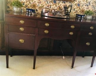Buffet
Mahogany in federal style / bow front double stacked bowed center drawers/ oval brass pulls/heavy tapered legs/ 66x36