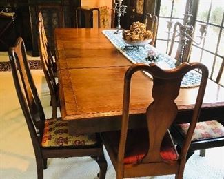 Mahogany dining table with contrasting border and narrow herringbone inlay - with cabriole legs(slightly carved knee) with pad foot /4 leaves(each one foot) / with leaves the table measure 9 feet x 42 inches wide/ without leaves 5 feet x42 wide.