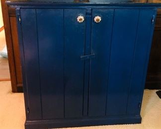 Indigo paint over pine  cabinet with top pediment