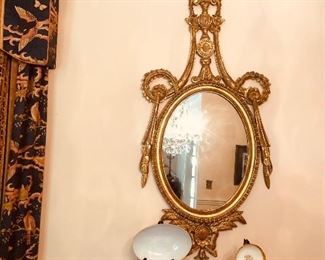 Italian gilded carved wood frame with high piercing above an oval mirror/4ft x 2 ft