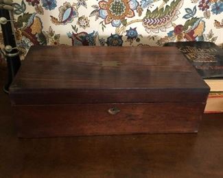 Lap desk late 19th century rosewood case with hinged top and having velvet stretched hinged writing surface with 2 open wells and one lidded well.
