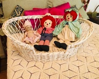 Wicker basket with vintage dolls