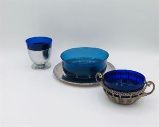 Art Deco Chrome with Cobalt Blue Glass Cocktail Glasses - Set of 11
4 FB Rogers ribbed plates
4 cobalt bowls
1 cobalt bowl nested in basket/jelly jam bowl.  Made in Germany