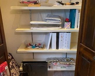 Closet with sewing accessories, patterns, books on quilting, pressing items, scissors, sewing small accessories 
