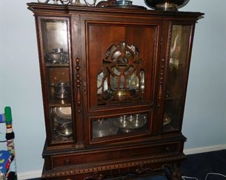 China cabinet and silverplate serving pieces