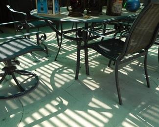 Large patio dining table with swivel chairs