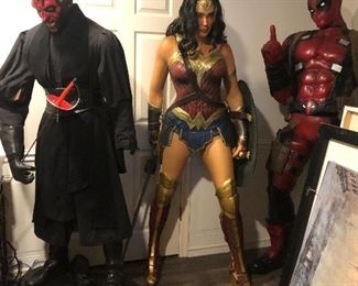 Life size Wonder Woman and Deadpool statues
