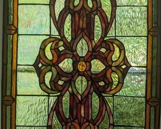 Close-up of one of a pair of stained glass panels; measures 24" tall x 18" wide.