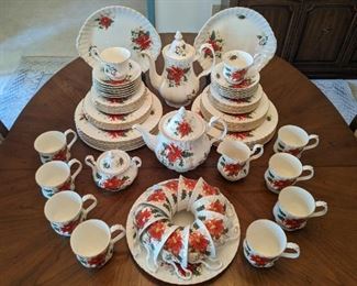 74-piece set of Royal Albert "Poinsettia" bone china; 1976 - 1997.