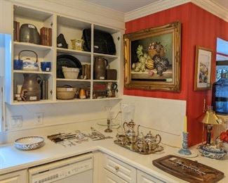Kitchen full of vintage pottery bowls and pitchers, splatter ware, silverplated flatware and tea/coffee set.