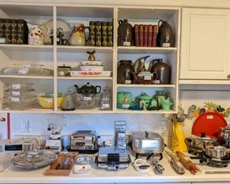 Wide variety of vintage kitchen goodies, antique books, Pyrex, Fire King, Oster blender, Cuisinart toaster, West Bend Waffle baker, Revere Ware, etc.