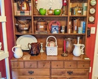 Vintage Ethan Allen 2-piece maple hutch, w/copper and brass collection, Portuguese porcelains, vintage pottery, Murano glass and vintage Reader's Digest condensed milk books.